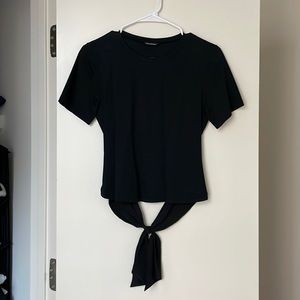 Black crop T shirt with opened lower back with a bow